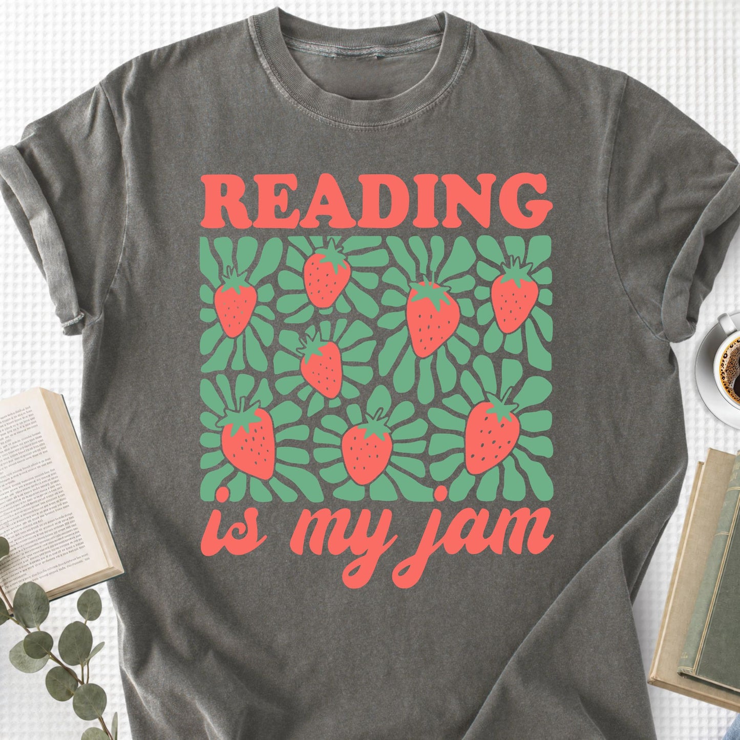 Gray t-shirt with 'Reading is my jam' design featuring strawberries on a textured surface.