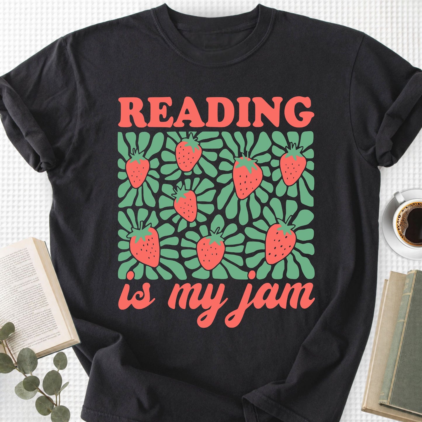 Black t-shirt with 'Reading is my jam' design featuring strawberries on a white background.